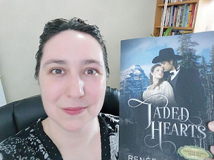 Picture of Renée holding her book Jaded Hearts